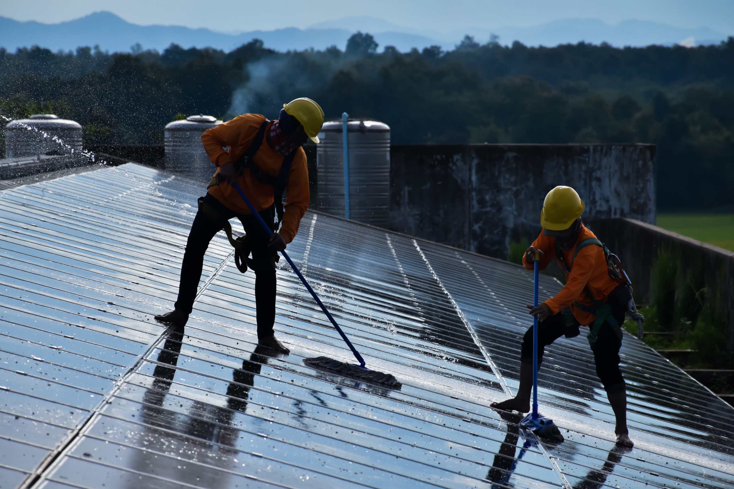 vecteezy_photovoltaic-technicians-were-cleaning-and-washing-the_8925008_263