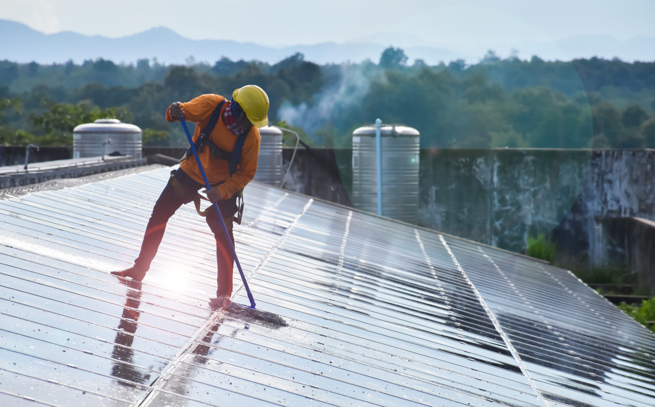 vecteezy_photovoltaic-technicians-were-cleaning-and-washing-the_8925937_318